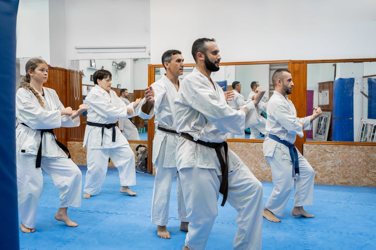 Diverse group of karateka practicing martial arts