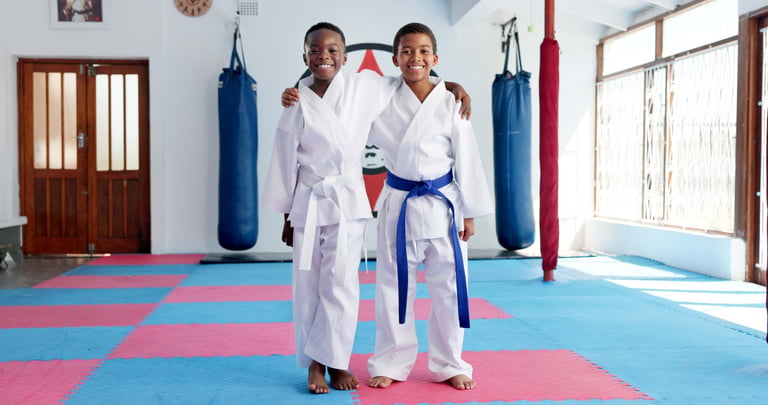 Children practicing karate in dojo